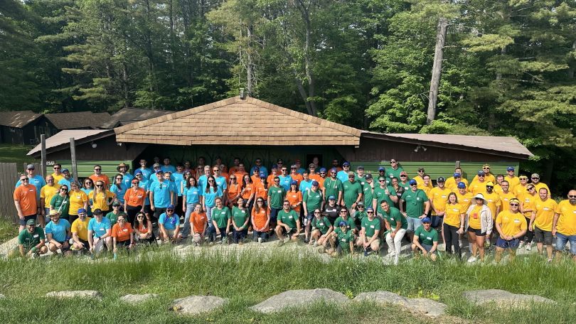 A group photo of Augury teammates at a camp